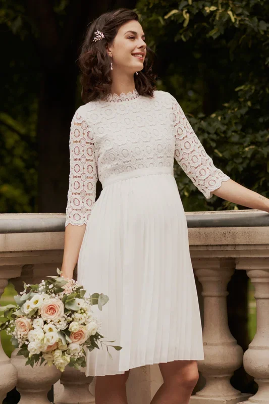 Maternity wedding dress with lace and pleated skirt